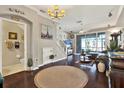 Inviting living room boasts hardwood floors, soft lighting, and a sliding glass door to the patio at 11190 Windsor Place Cir, Tampa, FL 33626