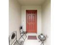 Covered front entrance with outdoor seating for a welcoming first impression at 12635 Tannencrest Dr, Riverview, FL 33579