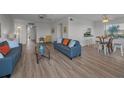 Bright living room with hardwood floors and comfortable seating, perfect for relaxing and entertaining at 19451 Gulf Blvd # 301, Indian Shores, FL 33785