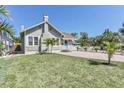 Well-maintained front yard with a charming bungalow-style home and a brick driveway at 2835 3Rd N Ave, St Petersburg, FL 33713