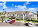 Well-maintained townhouse complex with ample parking, lush landscaping, and a serene residential setting at 435 Kensington Lake Crk, Brandon, FL 33511