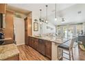 Gourmet kitchen showcasing granite counters, stainless appliances, and bar seating at 5088 Royal Palms Way # 304, New Port Richey, FL 34652