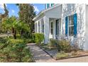 Beautiful home exterior showcasing a brick walkway with lush, well-maintained landscaping at 5305 Sagecrest Dr, Lithia, FL 33547