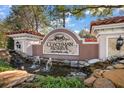 Elegant Coachman Reserve entrance sign with water feature, manicured landscaping and stone accents at 891 Lantern Way # 13-103, Clearwater, FL 33765