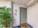 Condo entryway featuring modern decor and a welcoming atmosphere with brick and blue flooring at 100 Bluff View Dr # 614A, Belleair Bluffs, FL 33770