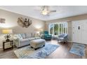 Bright and airy living room with modern furnishings, stylish decor and lots of natural light at 2401 Ecuadorian Way # 57, Clearwater, FL 33763