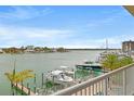 Enjoy the water view from the balcony showcasing waterfront living with docks and boats at 706 Bayway Blvd # 301, Clearwater Beach, FL 33767