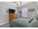 Comfortable bedroom featuring a queen bed and ample natural light at 21396 Snowy Orchid Ter, Land O Lakes, FL 34637