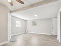 Bright bedroom featuring modern gray floors, neutral walls, and ample natural light from two windows at 2726 25Th N Ave, St Petersburg, FL 33713
