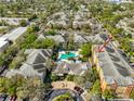 Aerial view showcasing the complex, a refreshing pool, lush landscaping, and convenient parking at 4207 S Dale Mabry Hwy # 2412, Tampa, FL 33611