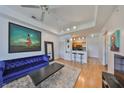 Bright living room features an open layout, a ceiling fan, recessed lighting, and wood-look floors at 4207 S Dale Mabry Hwy # 2412, Tampa, FL 33611