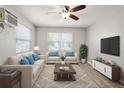Comfortable living room with neutral sofa, stylish rug, and flat screen TV at 4218 2Nd S Ave, St Petersburg, FL 33711