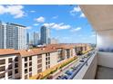 Balcony view of the city, showcasing nearby condos and a sunny, clear sky at 470 3Rd S St # 814, St Petersburg, FL 33701