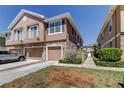 Inviting townhome with stone accents, private garages, and lush landscaping in a well-kept neighborhood at 565 52Nd N Ave, St Petersburg, FL 33703