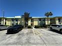 Exterior view of the condo building with parking and landscaping at 6125 113Th St # 505, Seminole, FL 33772