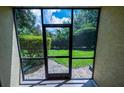 Screened patio showcasing the outdoor space and landscaping at 6125 113Th St # 505, Seminole, FL 33772