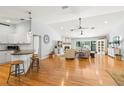 Open-concept space with hardwood floors, a fireplace, and lots of natural light at 8236 36Th N Ave, St Petersburg, FL 33710