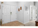 Inviting foyer with tile flooring and neutral walls, leading to other rooms at 7511 Terrace River Dr, Temple Terrace, FL 33637