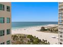 Expansive beach view with white sand and clear blue waters from a high-rise balcony at 1180 Gulf Blvd # 1604, Clearwater Beach, FL 33767