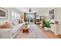 Bright living room with a sliding glass door to the balcony that provides natural light and outdoor access at 1316 Pasadena S Ave # 301, South Pasadena, FL 33707