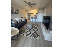 A sunlit living room boasts modern furnishings and an open concept layout at 1400 Gandy N Blvd # 305, St Petersburg, FL 33702