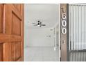Inviting entryway with bright white walls, tiled floors, and open view to the home's interior at 1600 Delaware Ne Ave, St Petersburg, FL 33703