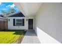 Close-up of the home's entrance, highlighting the walkway and front door at 509 13Th Nw Ave, Largo, FL 33770