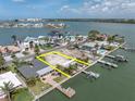 Aerial view of vacant lot surrounded by beautiful homes and waterfront at 575 Crystal Dr, Madeira Beach, FL 33708