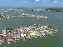 Aerial view of vacant lot surrounded by waterfront homes and beautiful scenery at 575 Crystal Dr, Madeira Beach, FL 33708