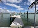 This waterfront property includes a private boat dock with boat lift, offering easy access to the water at 575 Crystal Dr, Madeira Beach, FL 33708