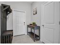 Welcoming entryway featuring neutral walls, tile flooring, and decorative furniture at 8512 Reedville St, New Port Richey, FL 34654