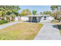 Quaint single-Gathering home with a covered entry and a well-manicured front yard at 10309 108Th Ave, Largo, FL 33773
