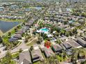 Spacious community featuring single-Gathering homes, lush greenery, lakes and community pool at 10315 Riverdale Rise Dr, Riverview, FL 33578