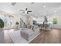 Bright and airy living space seamlessly connecting to a modern kitchen with stainless steel appliances at 11215 53Rd N Ave, St Petersburg, FL 33708