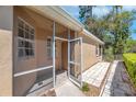 Inviting screened porch features a stone walkway and provides a seamless transition to outdoor living at 2206 Preservation Dr # 2206, Plant City, FL 33566