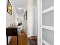 Neutral hallway with wood floors leads to living area, showcasing clean lines and storage at 330 Brandy Wine Dr # 330, Largo, FL 33771