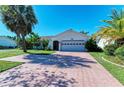 Lovely one-story home with lush landscaping and a spacious two-car garage at 3381 Conway Blvd, Port Charlotte, FL 33952