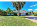 Inviting single-Gathering home featuring a lush lawn and two car garage at 3381 Conway Blvd, Port Charlotte, FL 33952