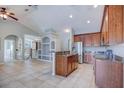 Stylish kitchen seamlessly connects to the living area, featuring stainless steel appliances and granite countertops at 6036 Fishhawk Crossing Blvd, Lithia, FL 33547