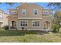 Charming townhouse featuring a covered porch and well manicured landscaping at 94 S Highland Ave # 2402, Tarpon Springs, FL 34689