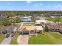 Beautiful home with a metal roof, lovely landscaping, long driveway, and spacious surroundings at 11006 Captain Dr, Spring Hill, FL 34608