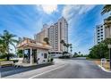 A condo building entrance featuring a security booth for controlled access at 1270 Gulf Blvd # 506, Clearwater Beach, FL 33767