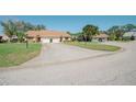 Inviting home with a well-maintained lawn, a long driveway, and a picturesque setting at 440 Pendleton Dr, Venice, FL 34292