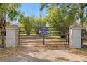 Private estate entrance with brick pillars and a gate bearing the 'Hacienda Diosas' name at 4508 Spring Rd, Valrico, FL 33596