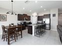 Kitchen features dark cabinets, stainless appliances and a dining area at 5412 Olano St, Palmetto, FL 34221