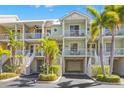Charming, multi-level condos with private balconies, lush landscaping, and convenient garage parking at 545 Bahia Beach Blvd, Ruskin, FL 33570