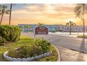 Beautiful community sign for Avalon at sunset surrounded by lush tropical landscaping at 5840 30Th S Ave # 305, Gulfport, FL 33707