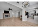 Open-concept living space with hardwood floors, fireplace, and easy access to kitchen at 1235 14Th N St, St Petersburg, FL 33705