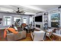 Inviting living room boasts hardwood floors, a fireplace, a ceiling fan, and built-in shelving for an airy atmosphere at 2005 Jackson N St, St Petersburg, FL 33704