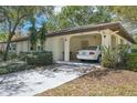 Inviting single-story home with a covered carport and well-maintained front yard at 2009 Halidom Way, Sun City Center, FL 33573